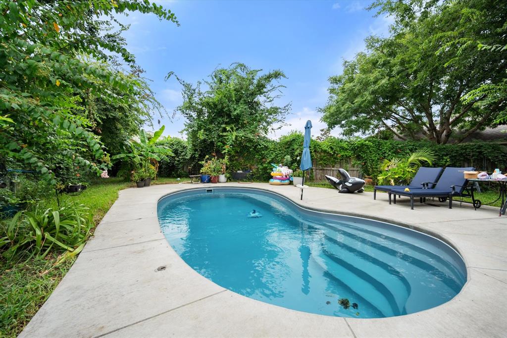 308 Faith Court Burleson, TX 76028 - Photo 37 of 40 a view of a swimming pool with a patio