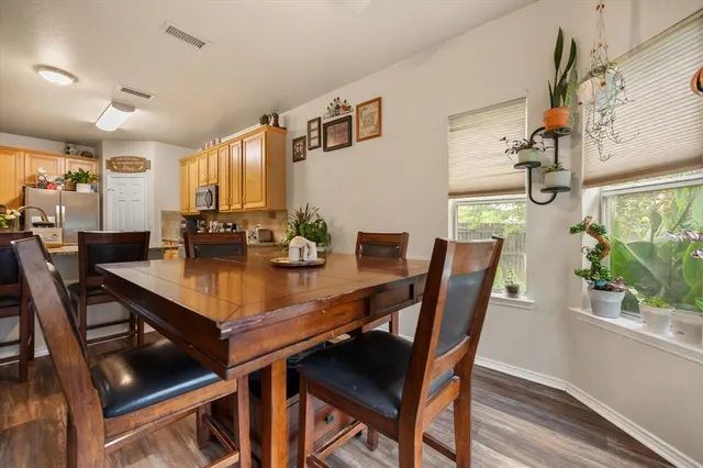 a kitchen with stainless steel appliances granite countertop a stove sink and cabinets