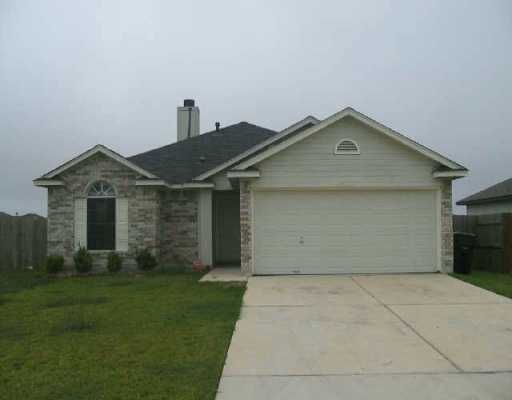 291 Bailey Loop Kyle, TX 78640 - Photo 1 of 1 a front view of a house with a yard and garage