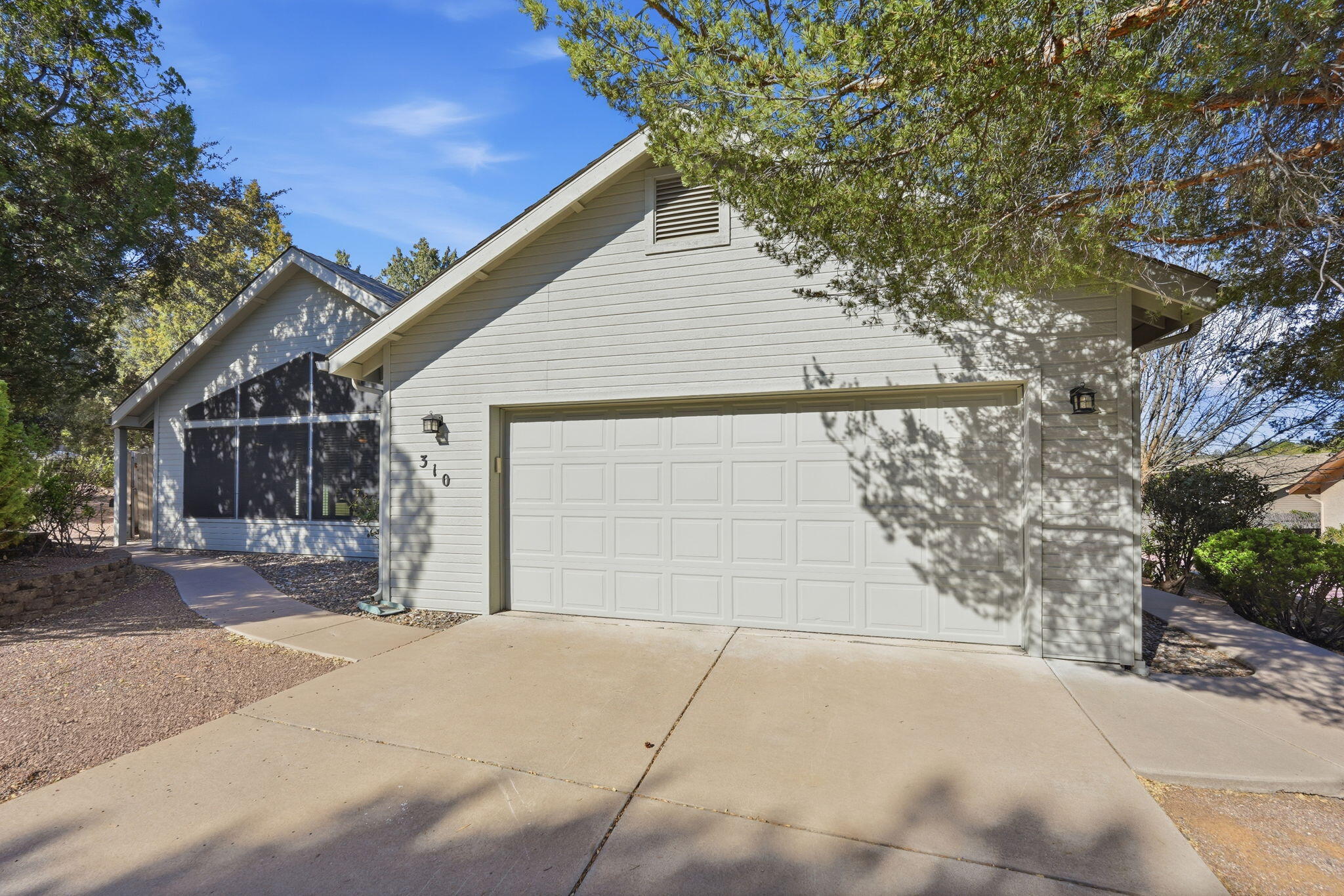 310 North Trailwood Road Payson, AZ 85541 - Photo 1 of 55 a front view of a house with a yard and garage