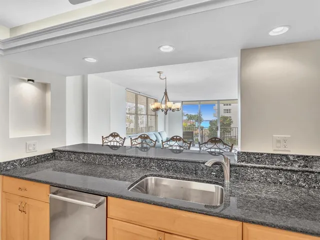 a view of a dining room with furniture and window