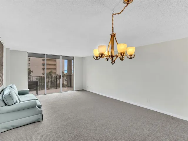 a bathroom with a granite countertop sink toilet and a mirror