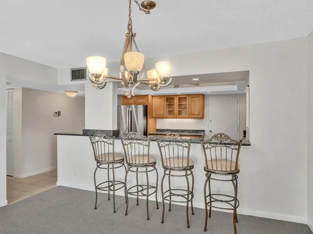 an empty room with a ceiling fan and a window