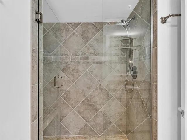 an empty room with a ceiling fan and a ceiling fan