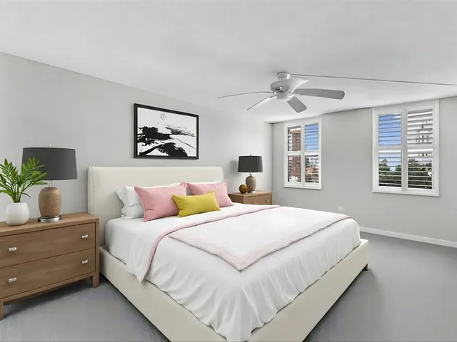 a bathroom with a granite countertop sink a toilet and bathtub