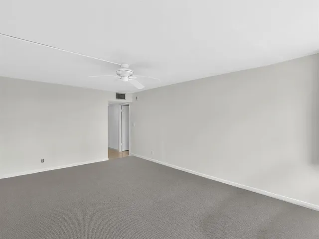 a view of swimming pool with outdoor seating and plants