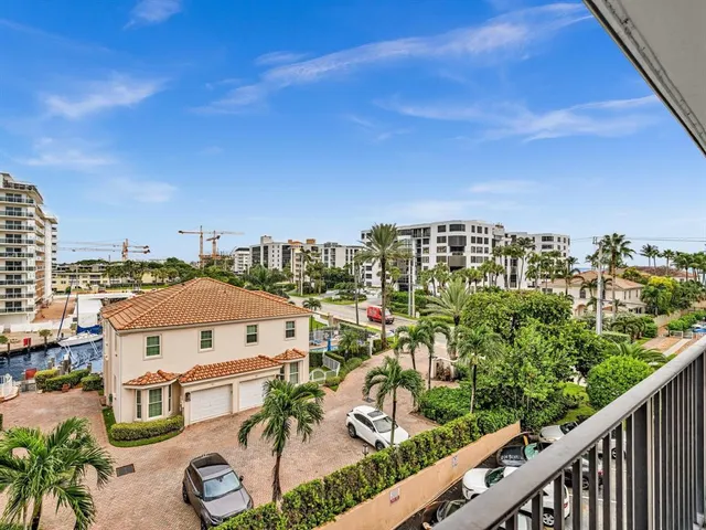 a kitchen with stainless steel appliances granite countertop a refrigerator a stove and a sink with granite countertops