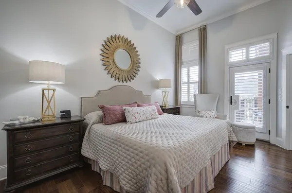 a bedroom with a bed and a chandelier