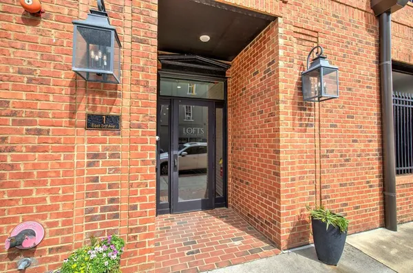 a view of a brick buildings with potted plant