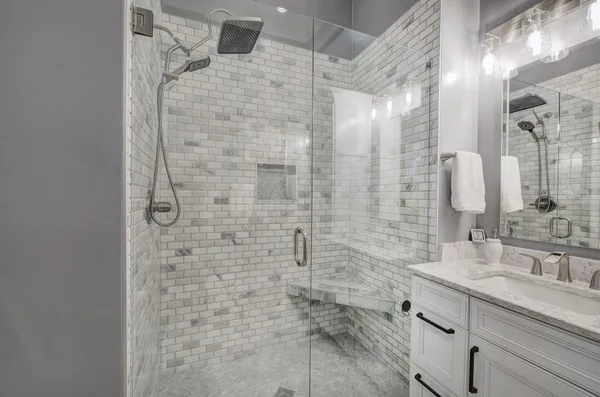 a bathroom with a shower and a sink