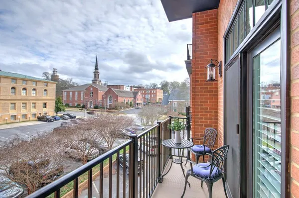 a view of balcony with furniture