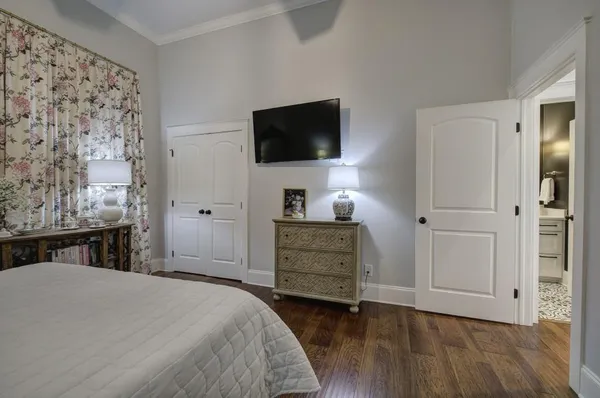 a bathroom with a toilet and a shower curtain