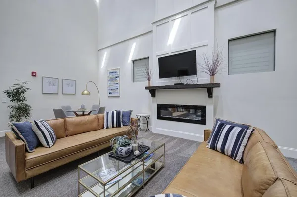 an outdoor space with furniture and ocean view