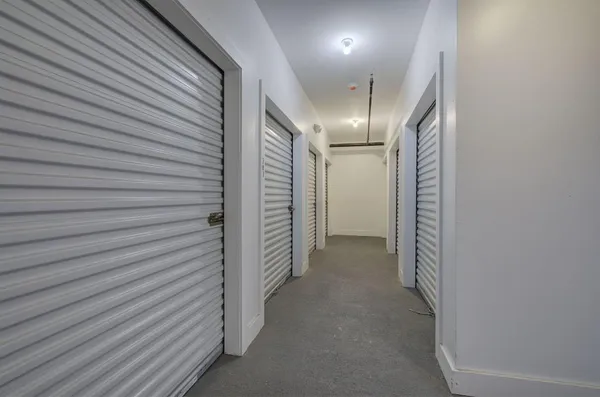 a view of parking garage with cars