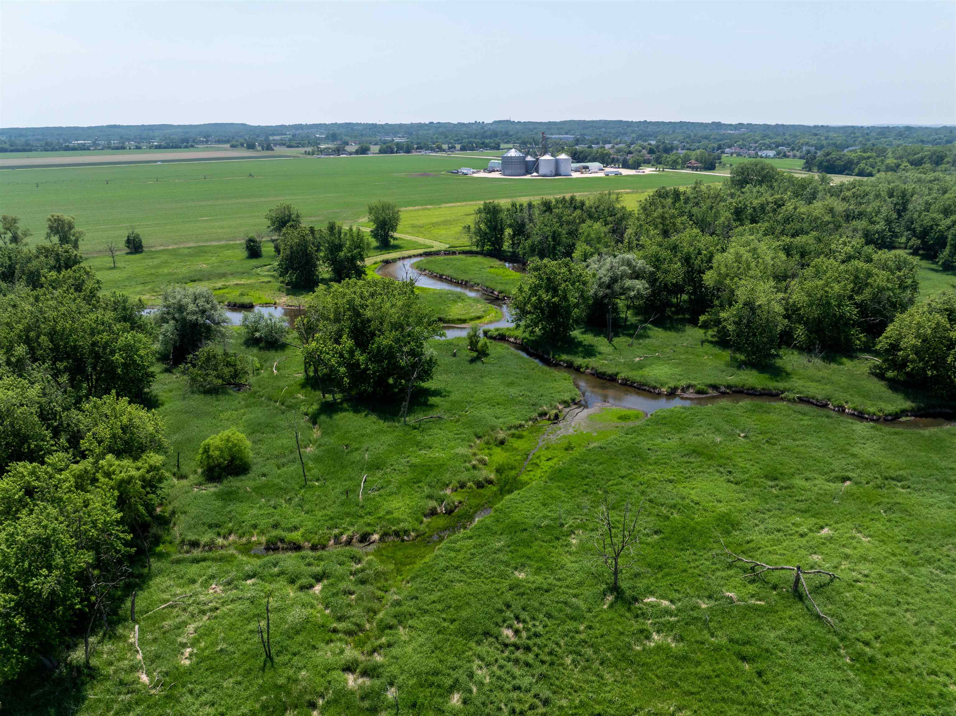 0 Deerpass Road Marengo, IL 60152 - Photo 28 of 61 an aerial view of green landscape with trees houses and mountain view