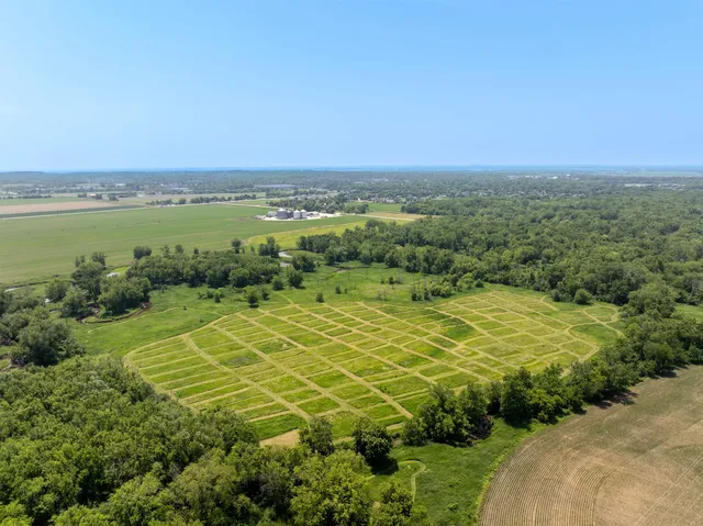 an aerial view of a houses with yard