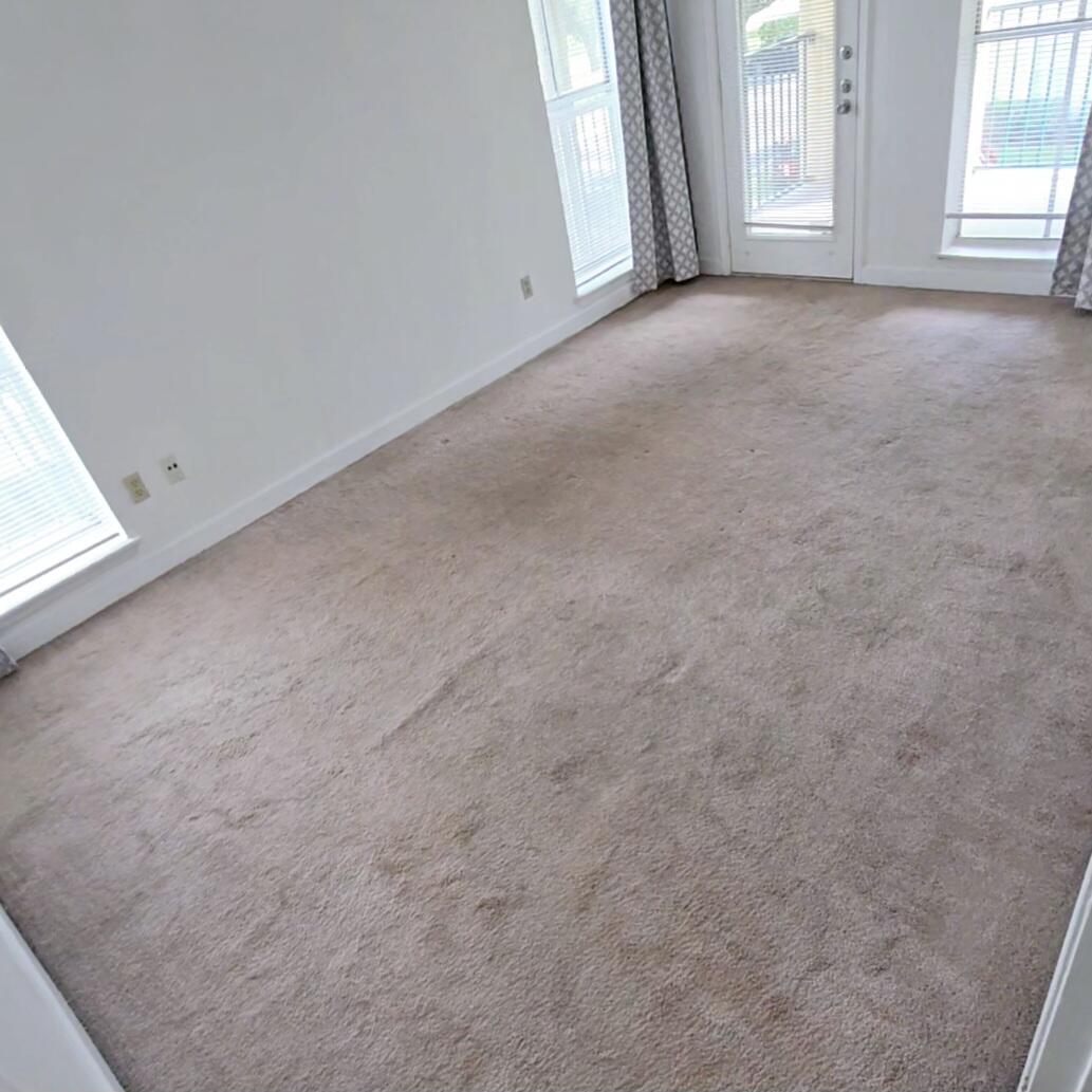 977 Riverside Drive, Unit 220 Coral Springs, FL 33071 - Photo 11 of 23 an empty room with windows