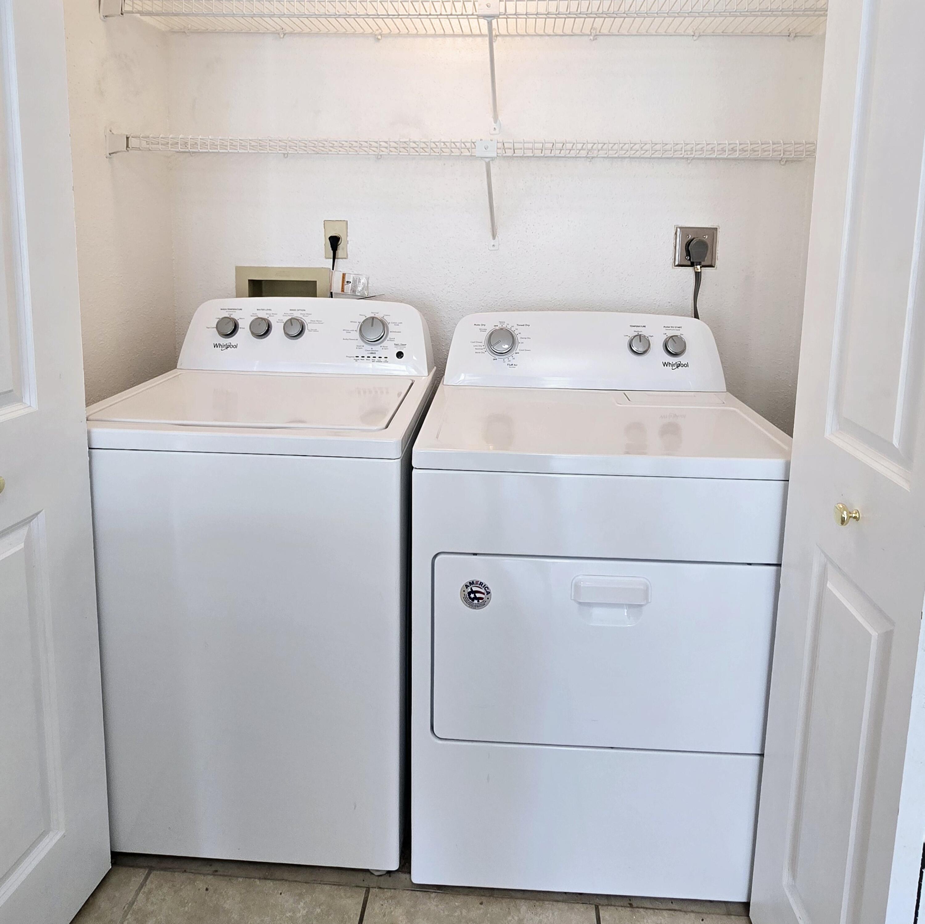 977 Riverside Drive, Unit 220 Coral Springs, FL 33071 - Photo 16 of 23 a utility room with dryer and washer