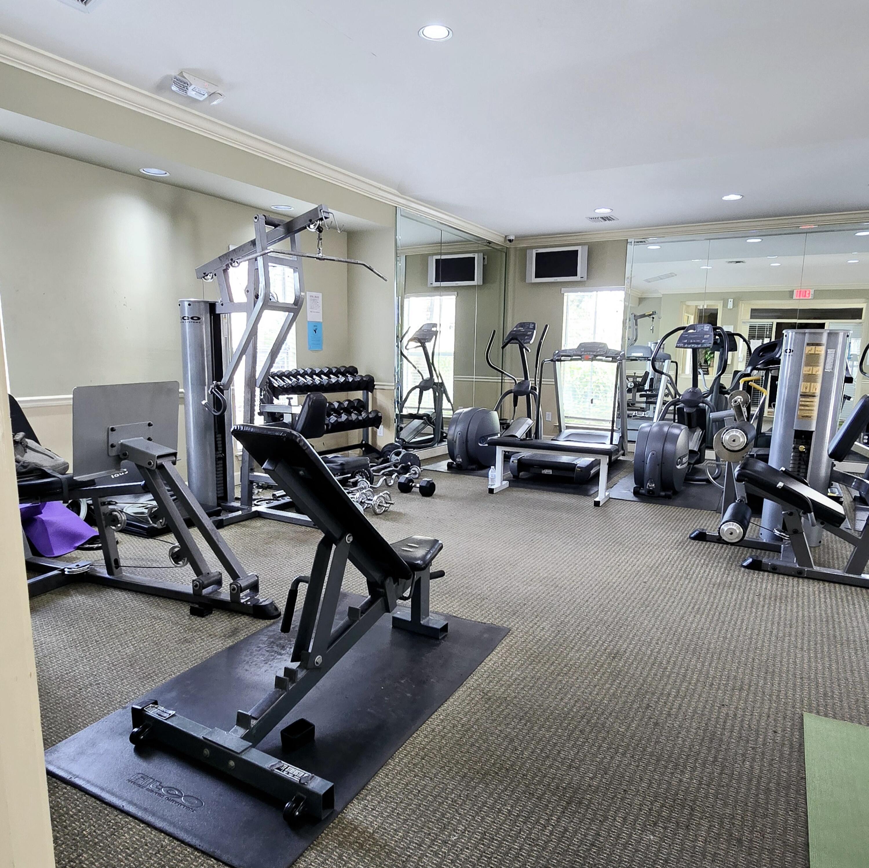 977 Riverside Drive, Unit 220 Coral Springs, FL 33071 - Photo 19 of 23 a view of a room with gym equipment