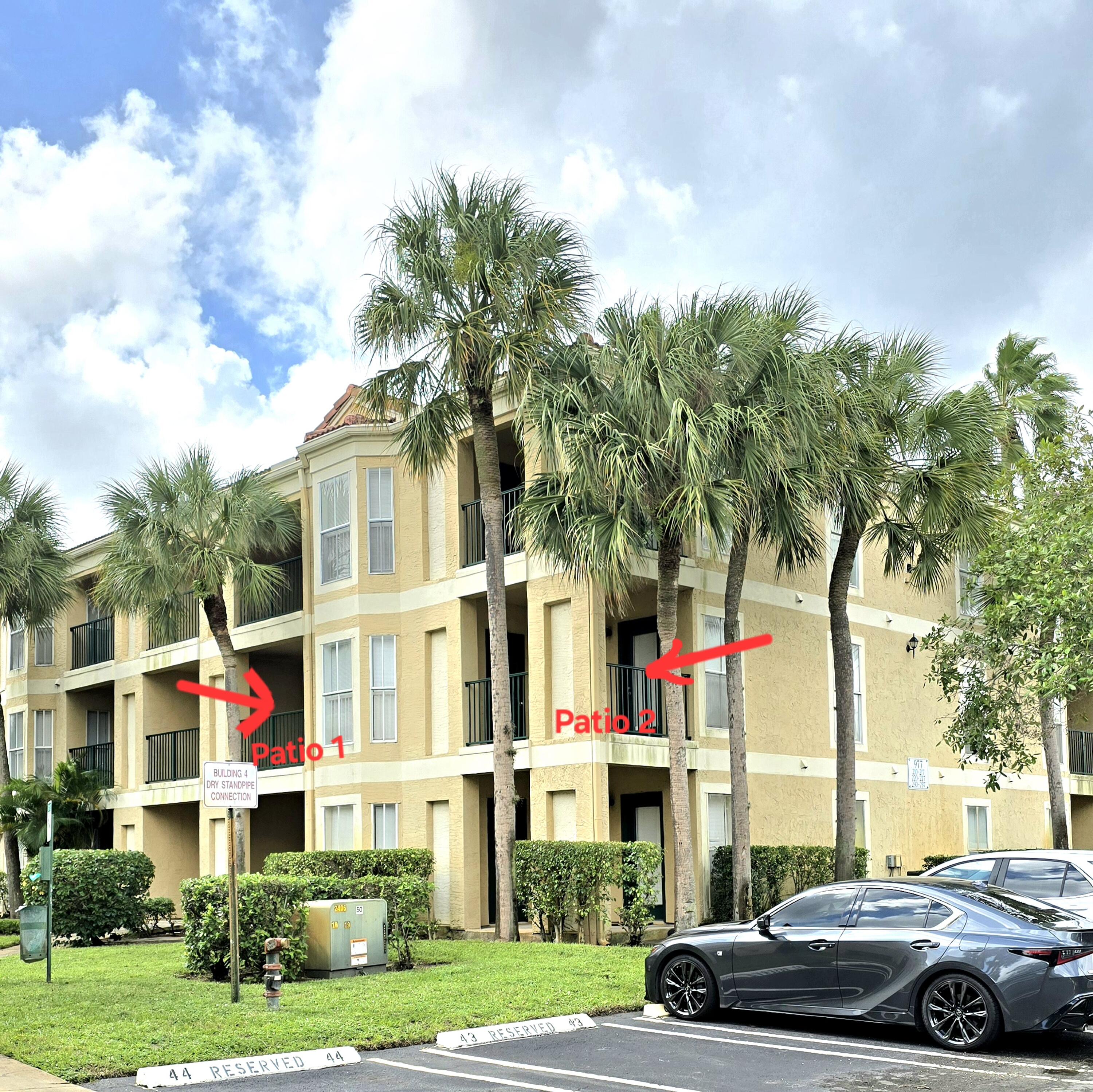 977 Riverside Drive, Unit 220 Coral Springs, FL 33071 - Photo 3 of 23 a front view of building with yard