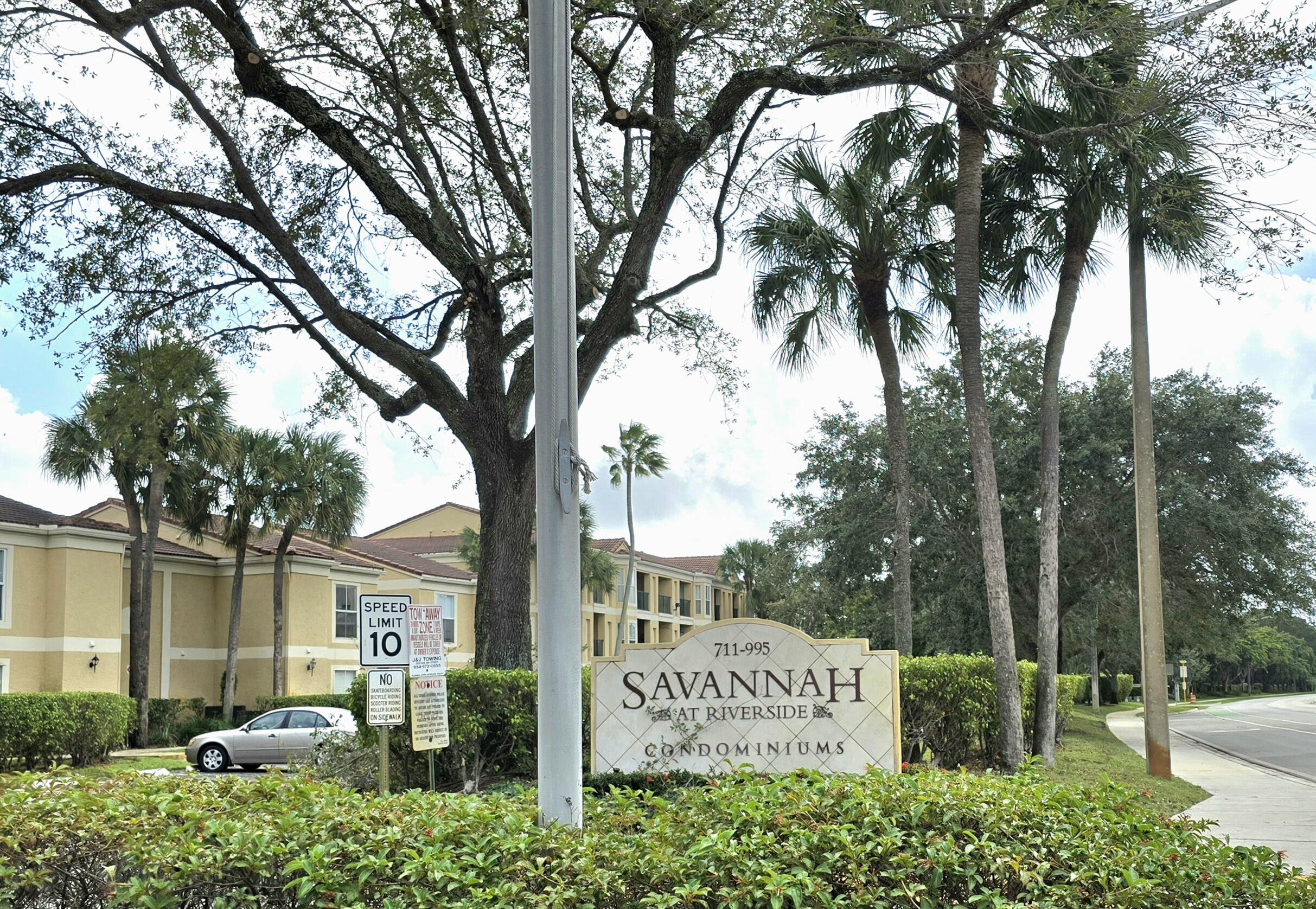 977 Riverside Drive, Unit 220 Coral Springs, FL 33071 - Photo 9 of 23 a sign on the side of a road