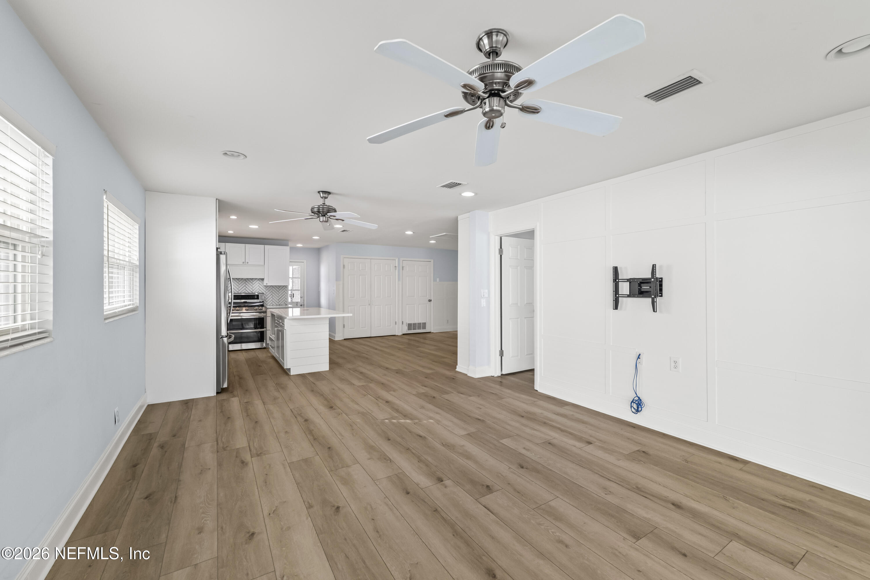 341 9th Street Atlantic Beach, FL 32233 - Photo 13 of 35 a view of empty room with wooden floor and ceiling fan