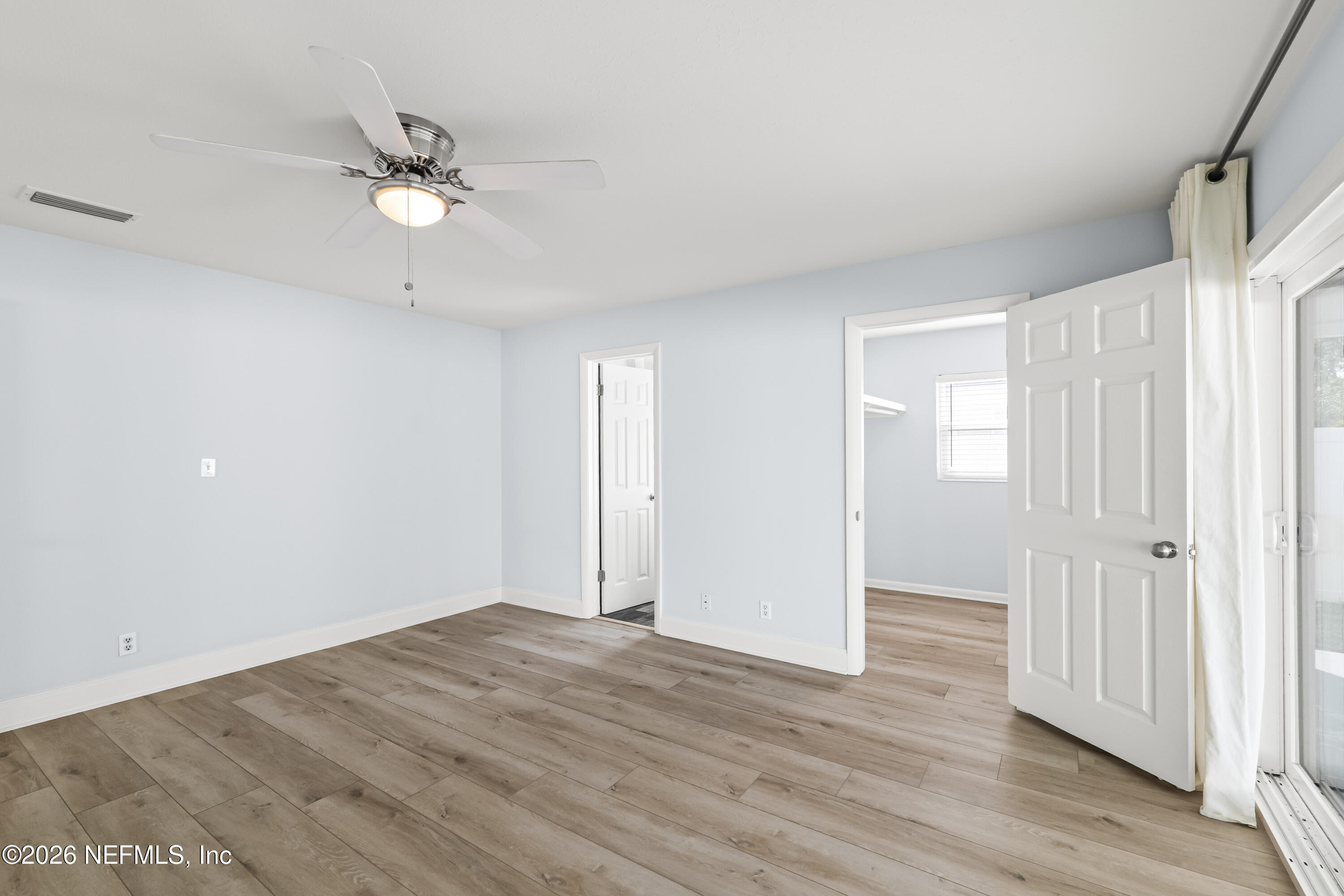 341 9th Street Atlantic Beach, FL 32233 - Photo 20 of 35 a view of an empty room with wooden floor