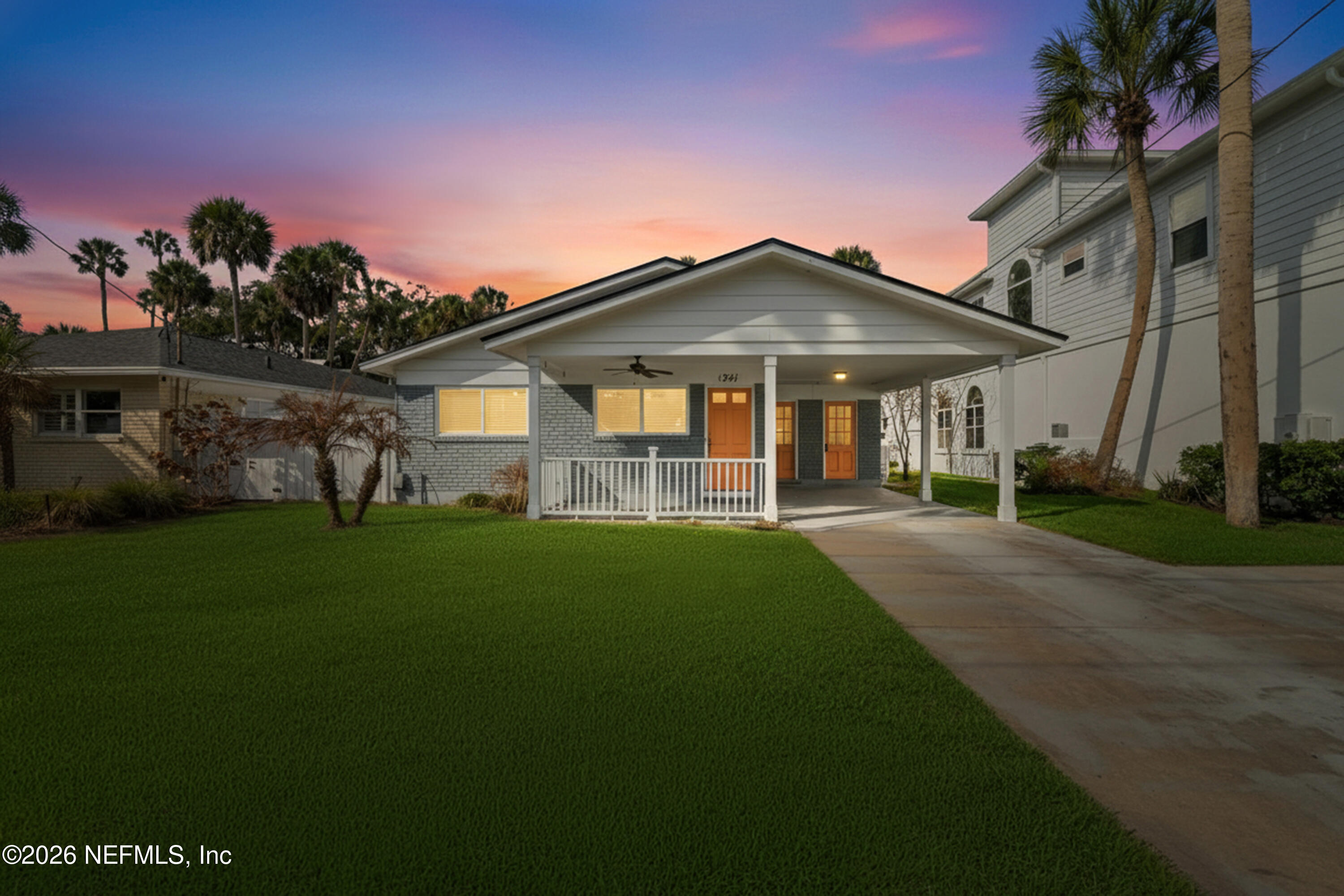 341 9th Street Atlantic Beach, FL 32233 - Photo 2 of 35 a front view of a house with a garden
