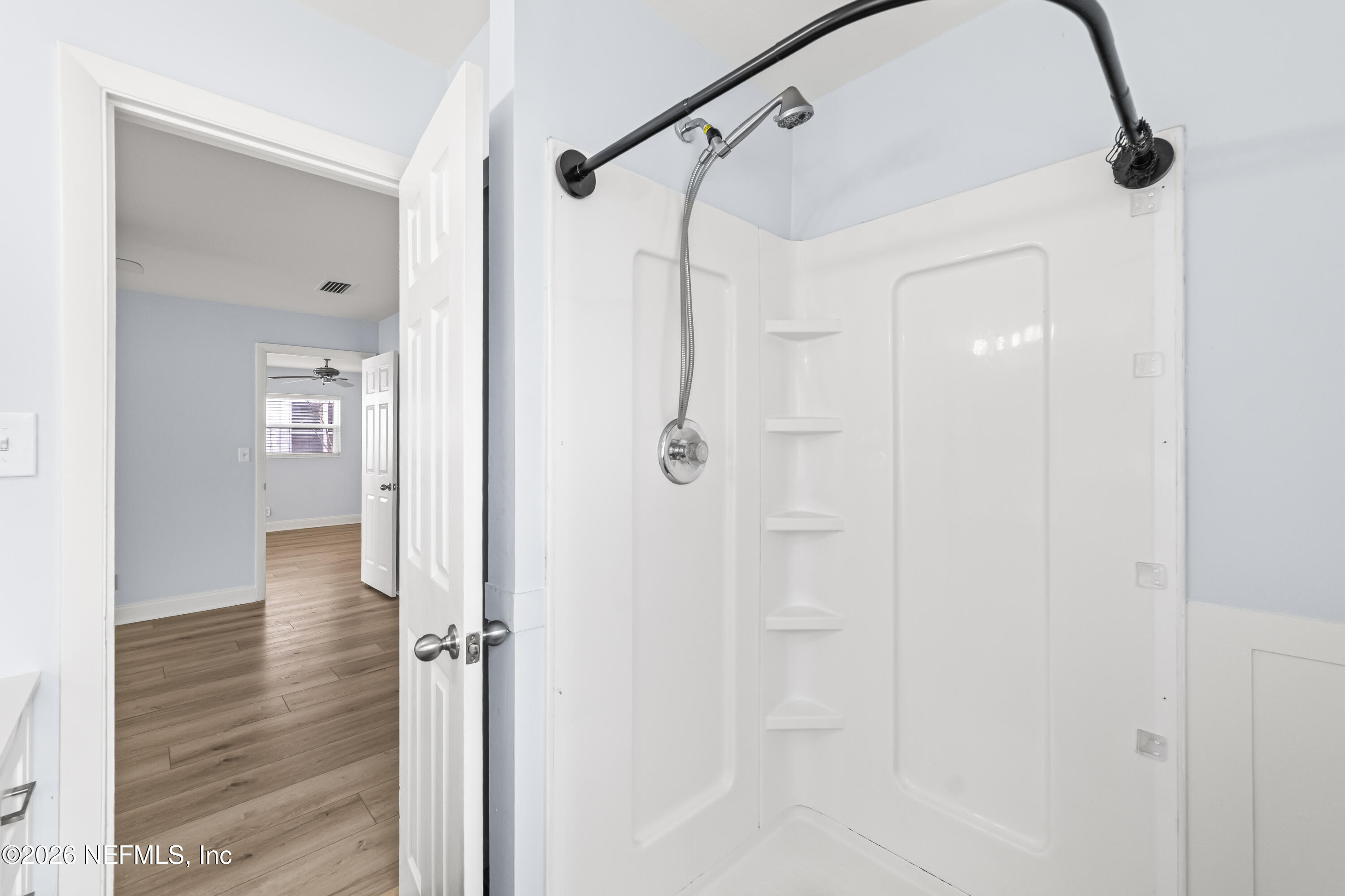 341 9th Street Atlantic Beach, FL 32233 - Photo 23 of 35 a bathroom with a glass shower door