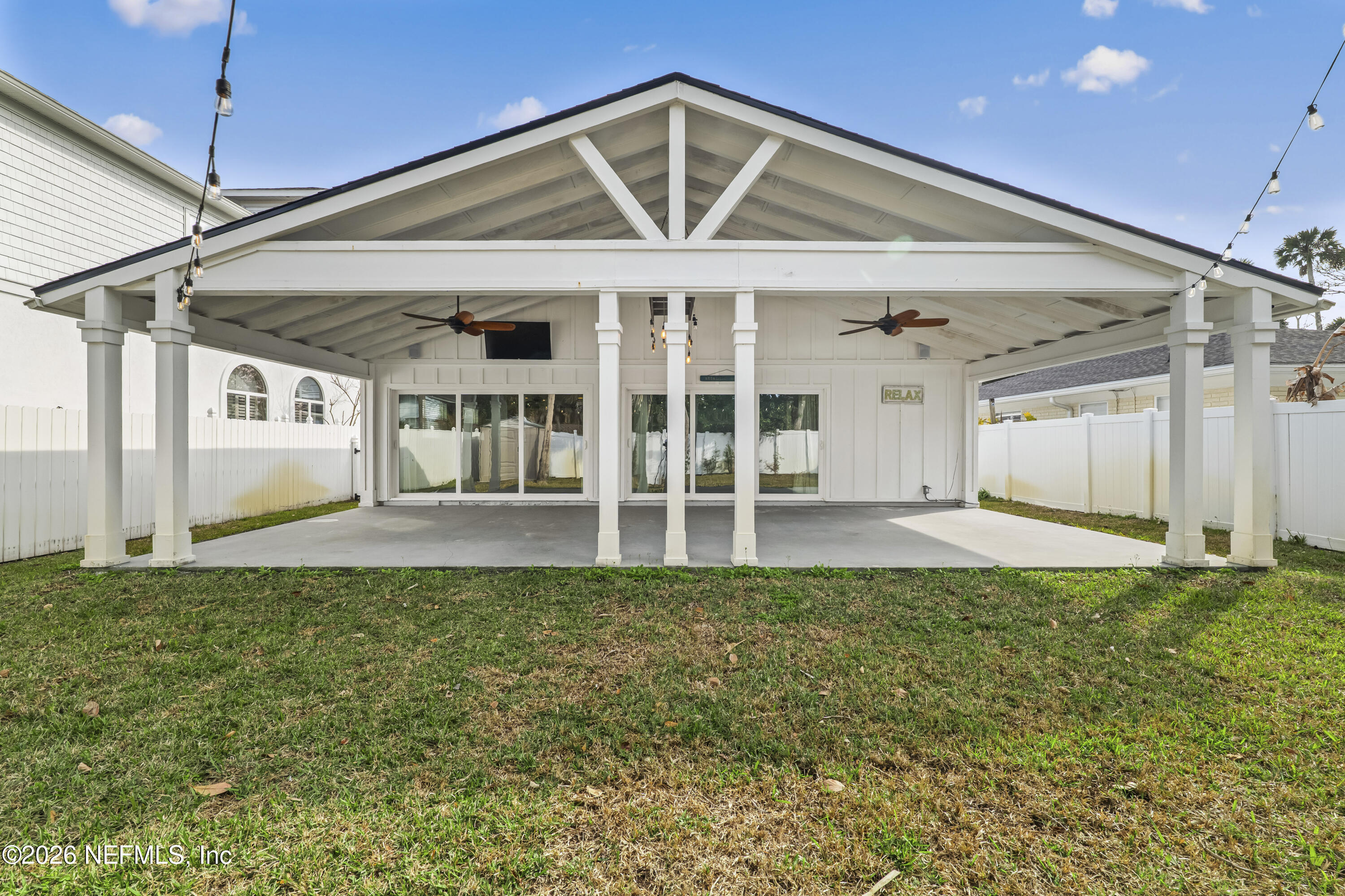 341 9th Street Atlantic Beach, FL 32233 - Photo 26 of 35 a view of a porch with a table and chairs