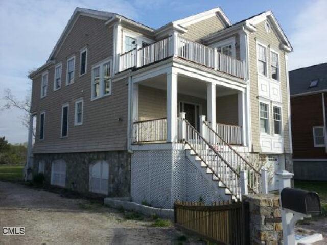 984 Fairfield Beach Road Fairfield, CT 06824 - Photo 1 of 1 a front view of a house with a yard
