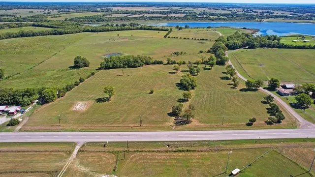 an aerial view of a residential houses with outdoor space