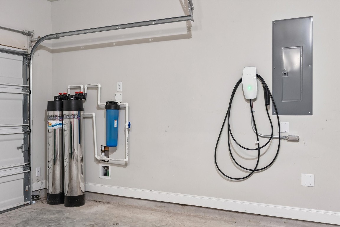 906 Barstow Drive Rosharon, TX 77583 - Photo 27 of 29 Garage features a full-home water system and an outlet ready for an EV charger (Tesla charger will be removed)