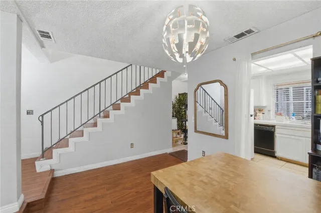 a bedroom with furniture and a wooden floor
