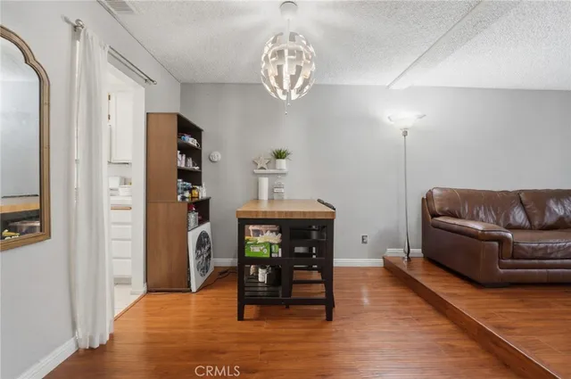 a view of washer and dryer with wooden floor