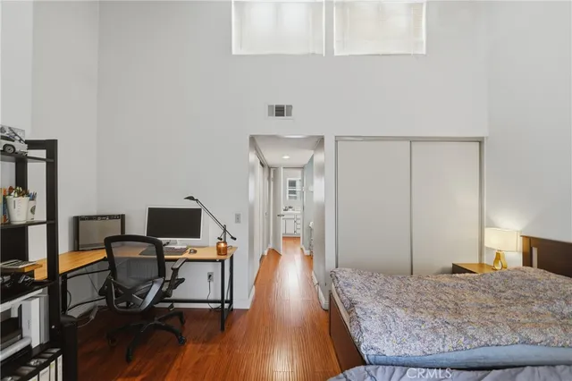 a view of an empty room and wooden floor