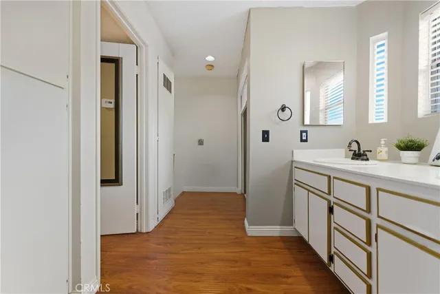 a view of an entryway with wooden floor