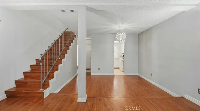 a view of a patio with table and chairs and potted plants
