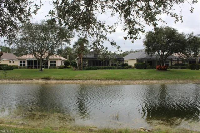 a view of a lake with houses in background