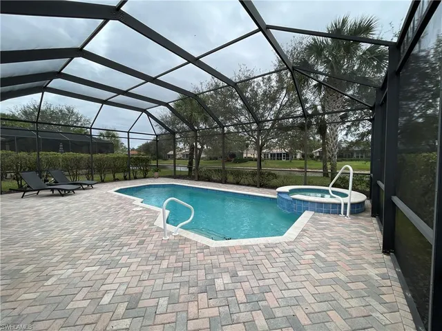 a view of a swimming pool with a patio