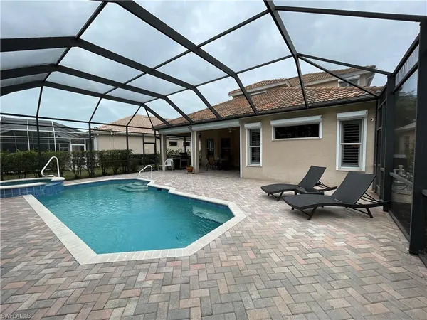 a view of a swimming pool with a patio