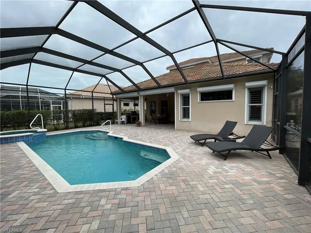a view of a swimming pool with a patio