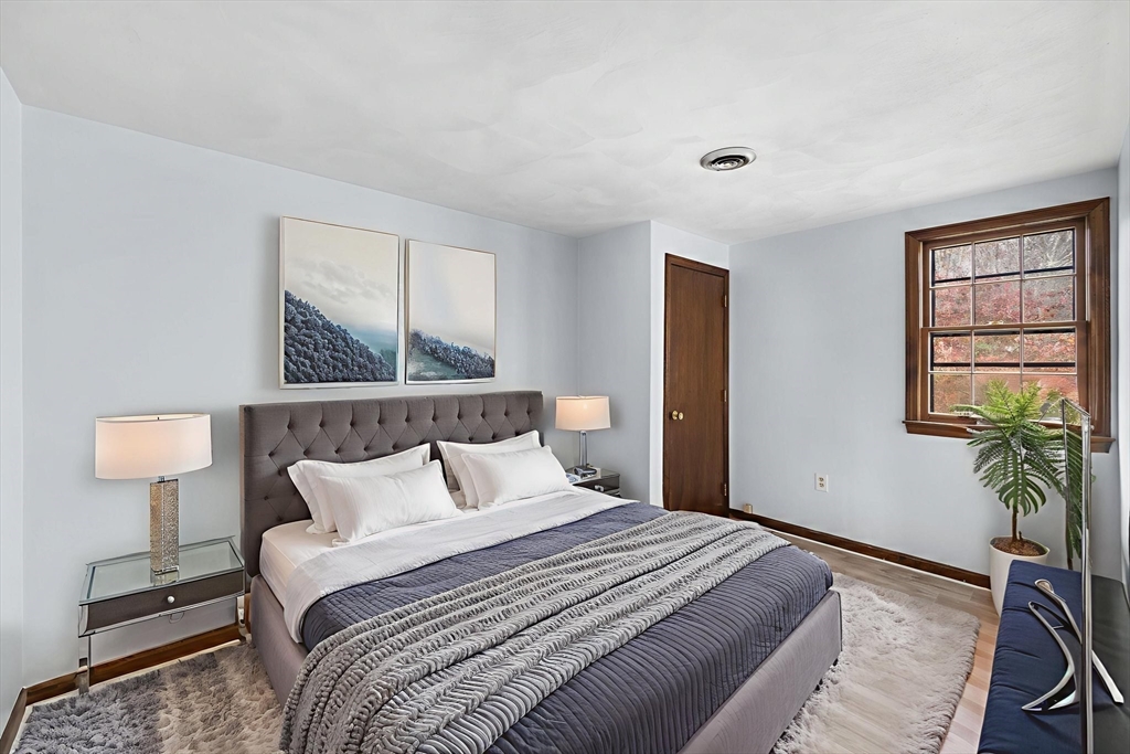 17 Blackstone Road Billerica, MA 01862 - Photo 12 of 32 a bedroom with bed and a night stand