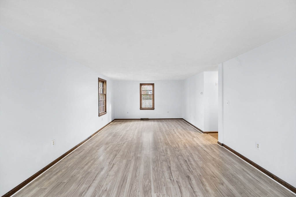 17 Blackstone Road Billerica, MA 01862 - Photo 16 of 32 an empty room with wooden floor and windows