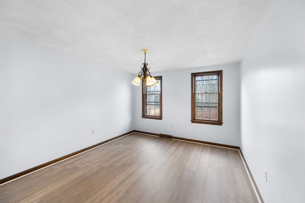 17 Blackstone Road Billerica, MA 01862 - Photo 17 of 32 an empty room with wooden floor and windows