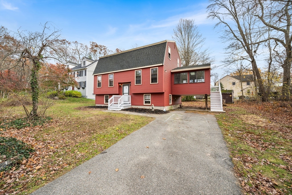 17 Blackstone Road Billerica, MA 01862 - Photo 25 of 32 a front view of a house with a yard covered with snow