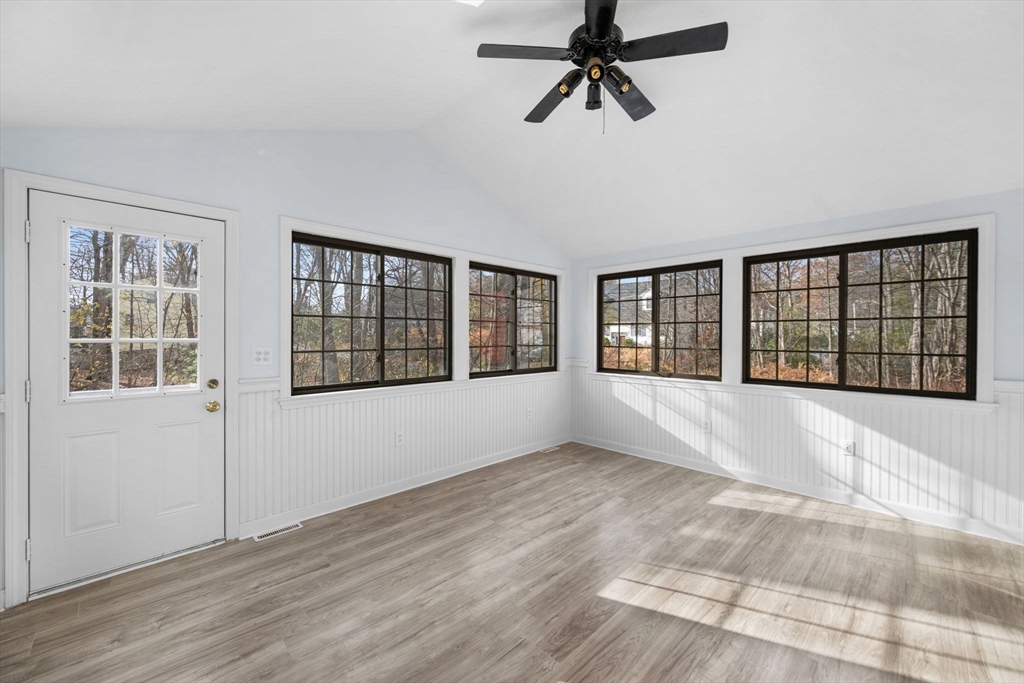 17 Blackstone Road Billerica, MA 01862 - Photo 7 of 32 a view of an empty room with a window and wooden floor