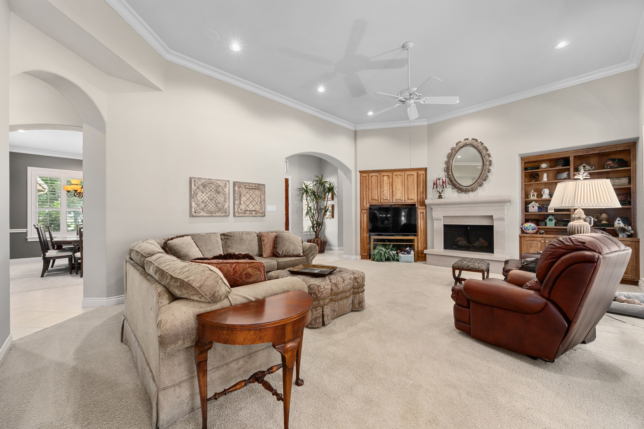 29 Meadows End Georgetown, TX 78628 - Photo 8 of 38 a living room with furniture a fireplace and a large mirror