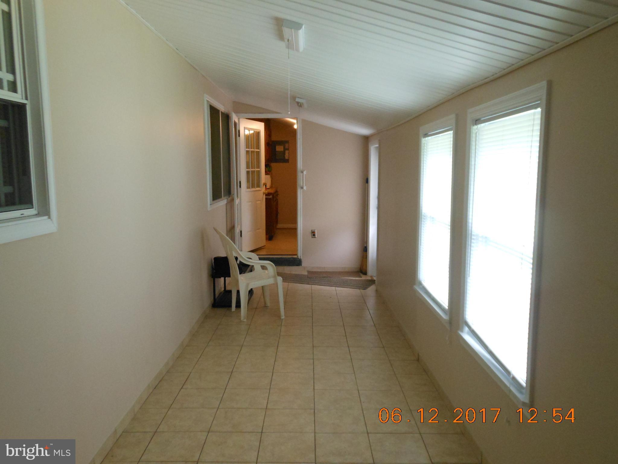 3704 Holly Grove Road Baltimore, MD 21220 - Photo 11 of 13 wooden floor in an empty room with a window
