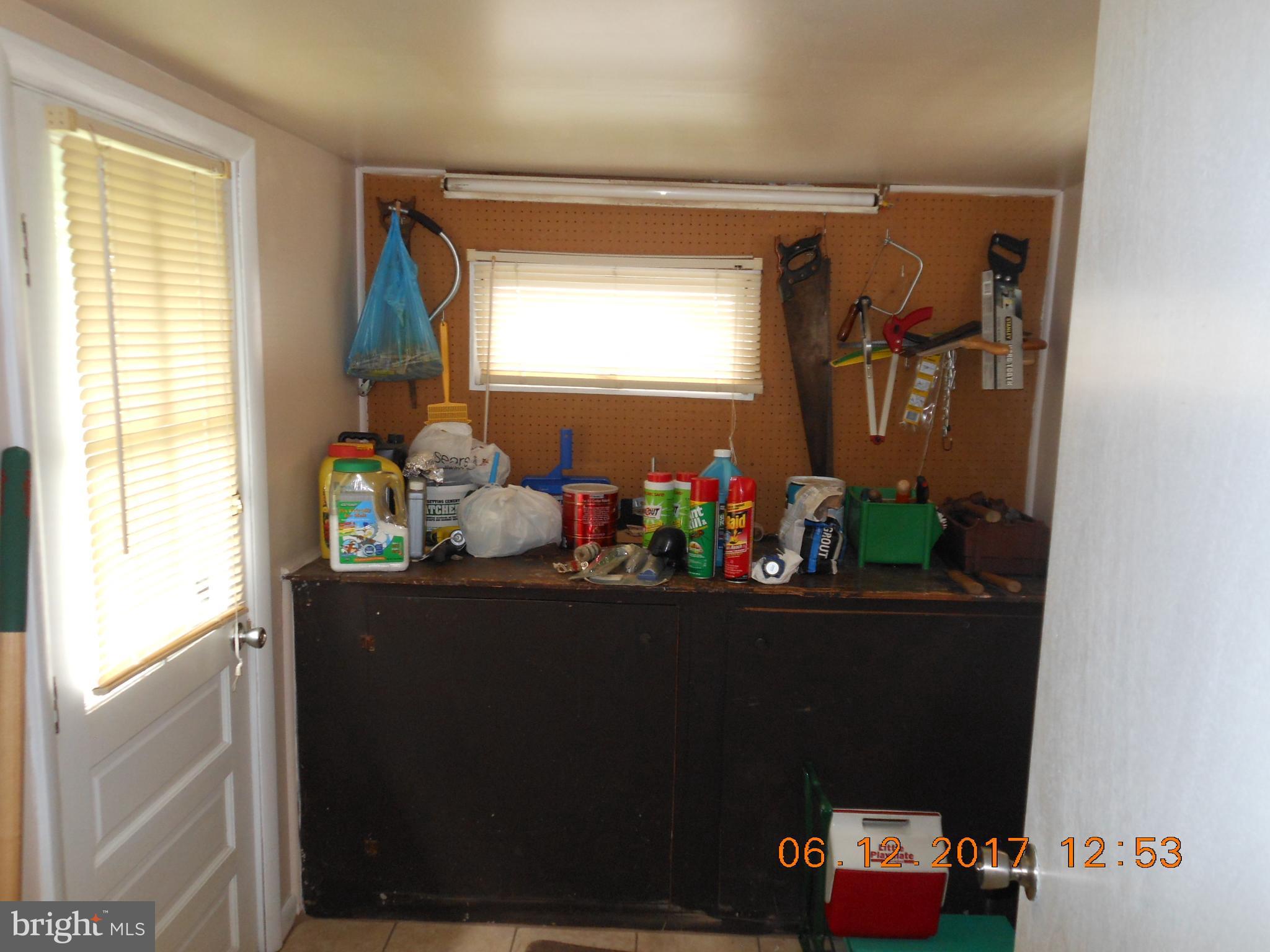 3704 Holly Grove Road Baltimore, MD 21220 - Photo 12 of 13 a room with furniture and flowers